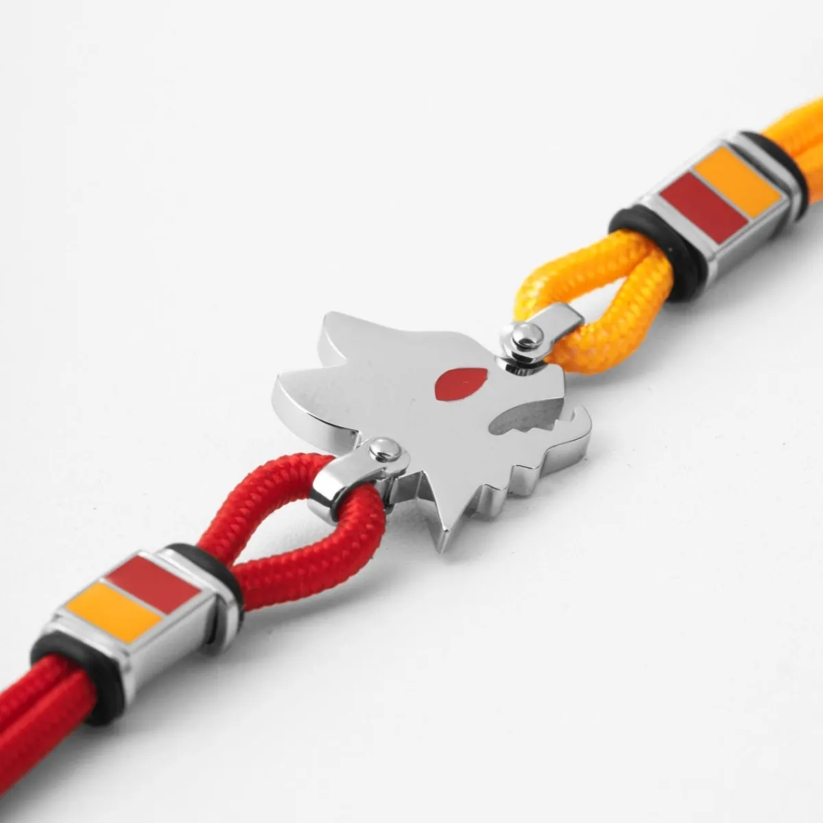 AS Roma Bracciale con placca centrale Lupetto in acciaio anallergico e cordino in tessuto regolabile rosso e giallo< Gioielli